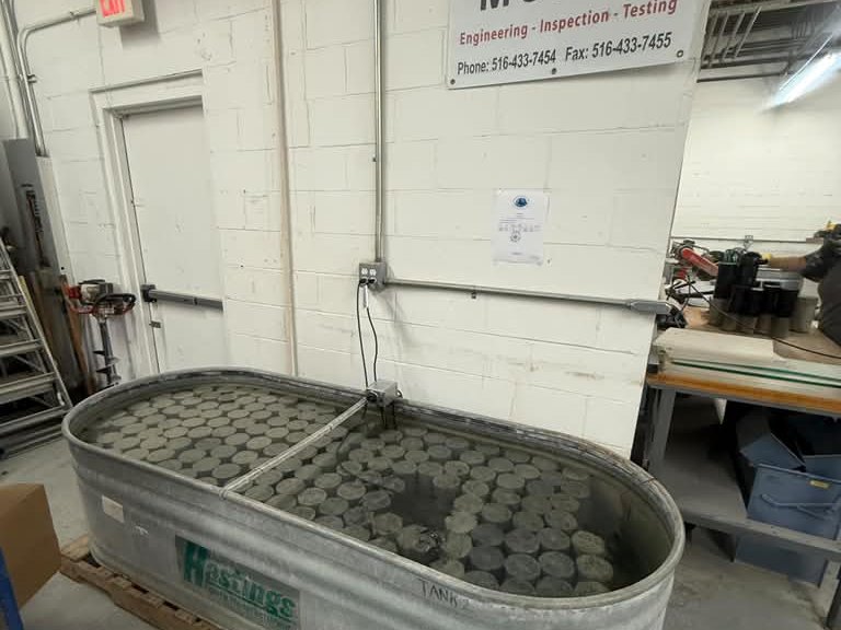 A second curing tank full of concrete cylinders in the Metric laboratory